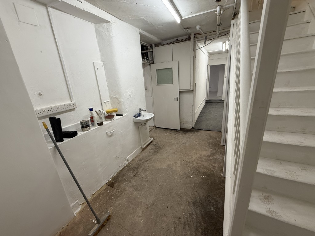 Lot: 5 - VACANT MIXED USE FOUR STOREY PROPERTY WITH FURTHER POTENTIAL - Basement room 3 entrance and stairs from staff kitchen